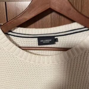 Holebrook cream sweater with blue stripes on shoulders.